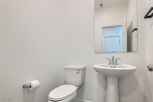 2821 Gaffer Film St, Las Vegas, NV 89156 - bathroom featuring toilet and baseboards