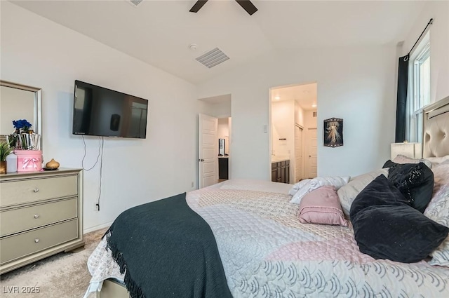 2821 Gaffer Film St, Las Vegas, NV 89156 - bedroom with lofted ceiling, light carpet, ensuite bath, and ceiling fan