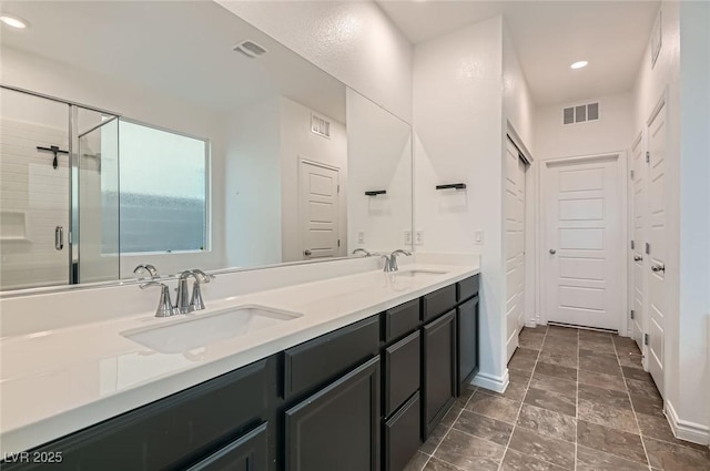 2821 Gaffer Film St, Las Vegas, NV 89156 - full bathroom featuring double vanity, recessed lighting, and a stall shower