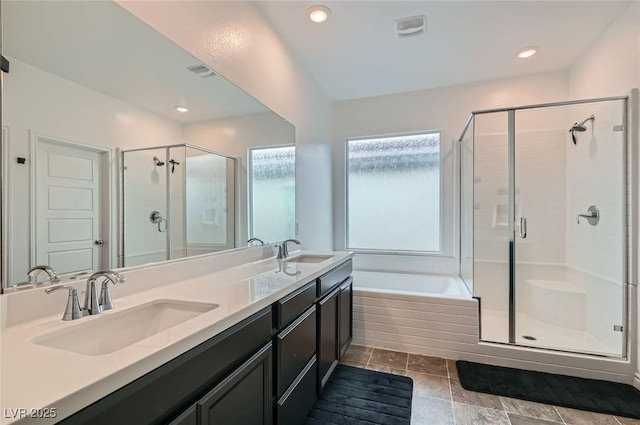 2821 Gaffer Film St, Las Vegas, NV 89156 - bathroom with a stall shower, a bath, double vanity, and recessed lighting