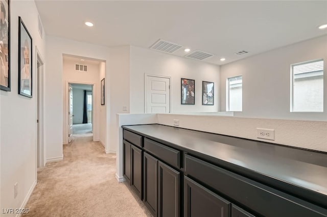2821 Gaffer Film St, Las Vegas, NV 89156 - corridor featuring light colored carpet, healthy amount of natural light, and recessed lighting