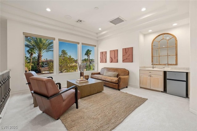 8712 Mesa Canogo Dr, Las Vegas, NV 89148 - living area featuring recessed lighting, light carpet, plenty of natural light, and wet bar