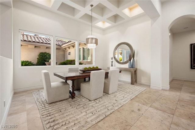 8712 Mesa Canogo Dr, Las Vegas, NV 89148 - dining room with arched walkways, coffered ceiling, a high ceiling, beam ceiling, and plenty of natural light