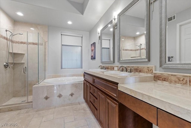 30 Via Mantova Unit 202, Henderson, NV 89011 - bathroom featuring a bath, a shower stall, double vanity, recessed lighting, and stone tile floors