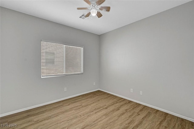1213 Bistro Bay Ave, North Las Vegas, NV 89086 - empty room with wood finished floors and a ceiling fan