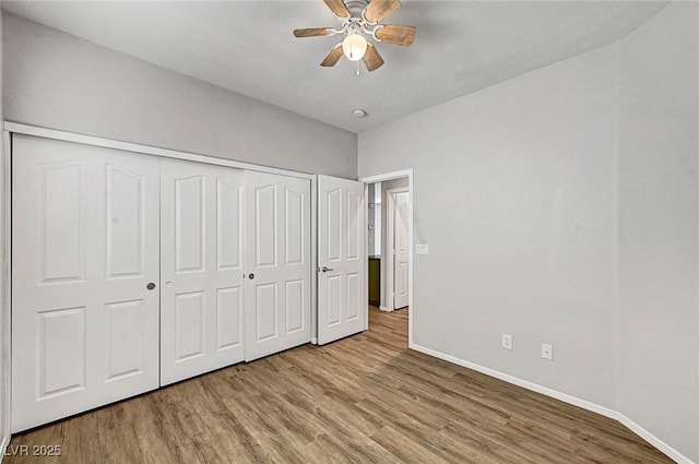 1213 Bistro Bay Ave, North Las Vegas, NV 89086 - unfurnished bedroom featuring wood finished floors, a closet, and a ceiling fan