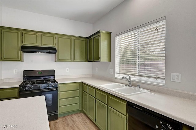 1213 Bistro Bay Ave, North Las Vegas, NV 89086 - kitchen featuring under cabinet range hood, green cabinets, and black appliances