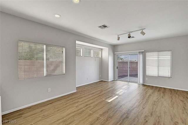 1213 Bistro Bay Ave, North Las Vegas, NV 89086 - unfurnished room with track lighting, wood finished floors, and recessed lighting