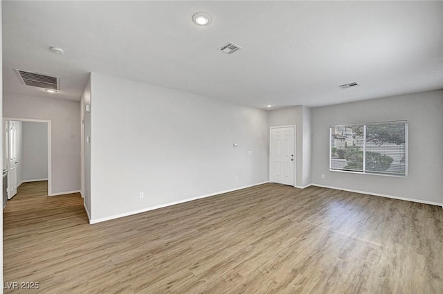 1213 Bistro Bay Ave, North Las Vegas, NV 89086 - unfurnished room featuring light wood finished floors, recessed lighting, and a smoke detector