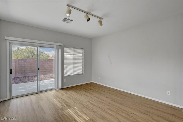 1213 Bistro Bay Ave, North Las Vegas, NV 89086 - spare room featuring wood finished floors and track lighting
