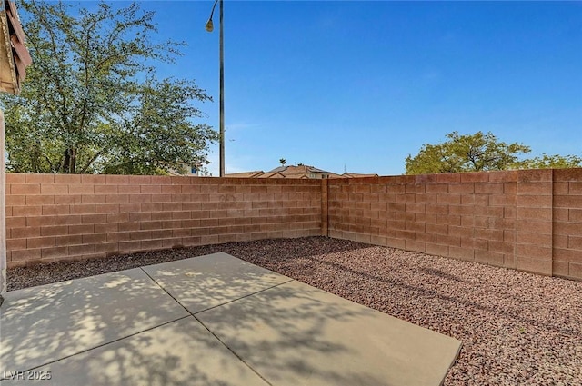 1213 Bistro Bay Ave, North Las Vegas, NV 89086 - fenced backyard with a patio