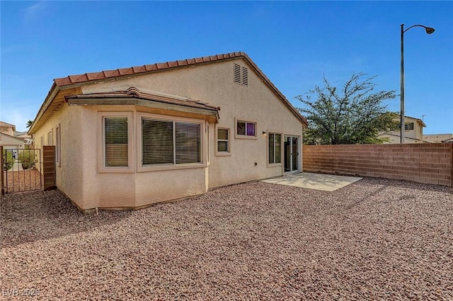 1213 Bistro Bay Ave, North Las Vegas, NV 89086 - back of house with stucco siding and a patio