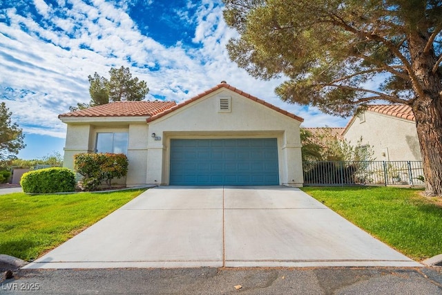 2251 Vangogh Dr, Henderson, NV 89074 - mediterranean / spanish house with a tile roof, concrete driveway, stucco siding, and an attached garage