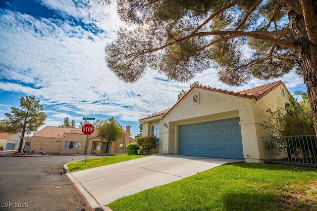 2251 Vangogh Dr, Henderson, NV 89074 - mediterranean / spanish-style house with stucco siding, concrete driveway, a tile roof, and an attached garage