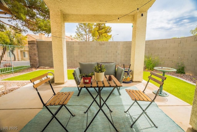 2251 Vangogh Dr, Henderson, NV 89074 - fenced backyard with a patio and an outdoor hangout area