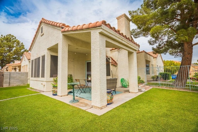 2251 Vangogh Dr, Henderson, NV 89074 - back of property with a tile roof, a patio area, and stucco siding