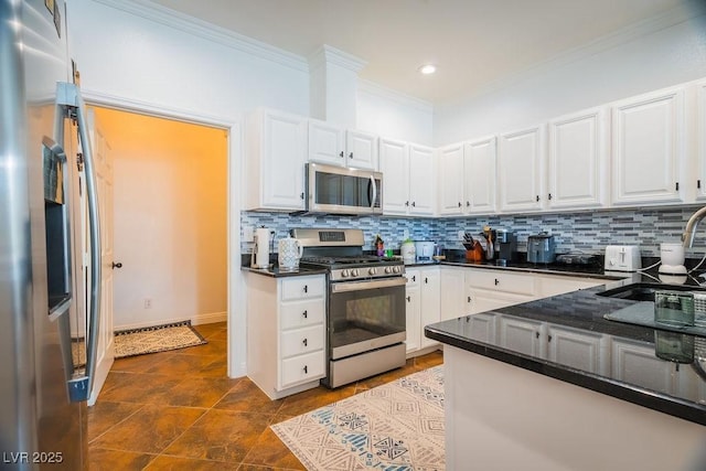 2251 Vangogh Dr, Henderson, NV 89074 - kitchen featuring appliances with stainless steel finishes, tasteful backsplash, crown molding, white cabinets, and recessed lighting