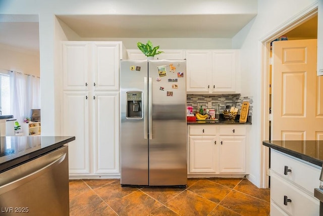 2251 Vangogh Dr, Henderson, NV 89074 - kitchen featuring stainless steel appliances, backsplash, white cabinetry, and dark stone countertops