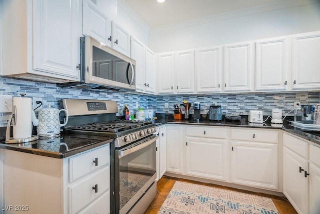 2251 Vangogh Dr, Henderson, NV 89074 - kitchen with stainless steel appliances, ornamental molding, white cabinets, and backsplash