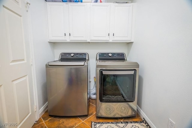 2251 Vangogh Dr, Henderson, NV 89074 - washroom with washer and dryer, cabinet space, and dark tile patterned floors