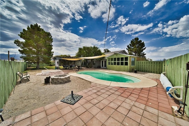 2910 Sunset St, Pahrump, NV 89060 - view of pool with a fire pit, a patio area, and a fenced backyard