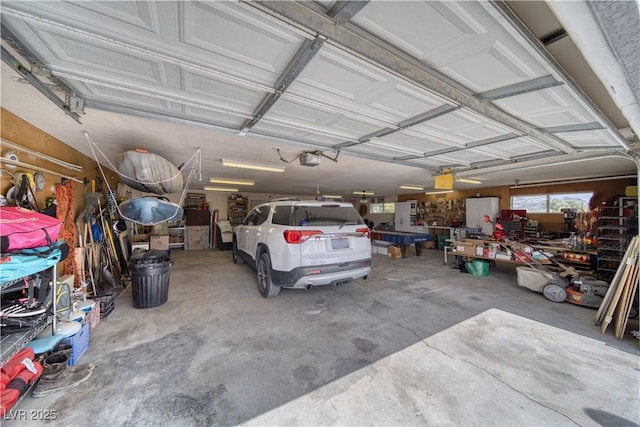 2910 Sunset St, Pahrump, NV 89060 - garage featuring a garage door opener and a workshop area
