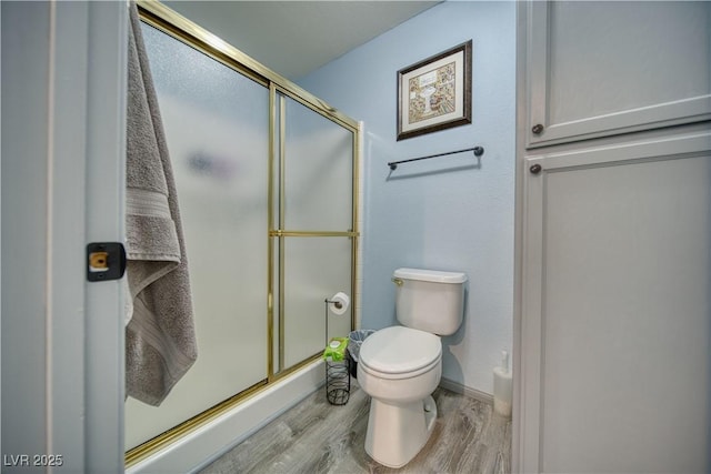2910 Sunset St, Pahrump, NV 89060 - bathroom with wood finished floors and a shower with shower door