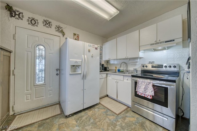 2910 Sunset St, Pahrump, NV 89060 - kitchen with white fridge with ice dispenser, stainless steel range with electric stovetop, under cabinet range hood, white cabinetry, and light countertops