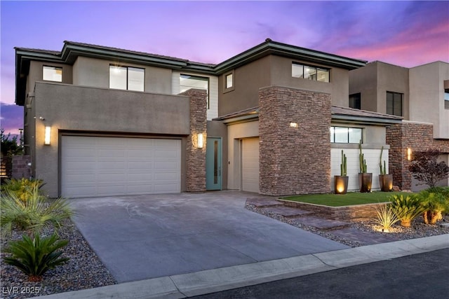 6234 Amber View St, Las Vegas, NV 89135 - view of front of house featuring stucco siding, a garage, stone siding, and concrete driveway
