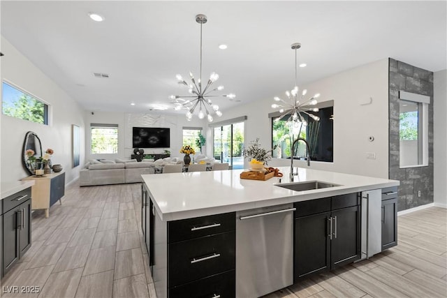 6234 Amber View St, Las Vegas, NV 89135 - kitchen featuring stainless steel dishwasher, a chandelier, light countertops, and recessed lighting
