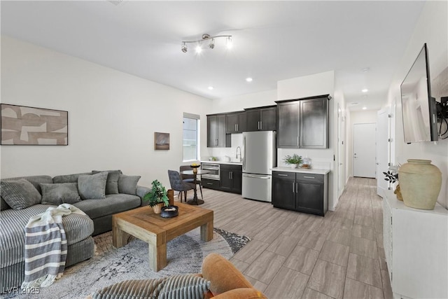 6234 Amber View St, Las Vegas, NV 89135 - living room featuring light wood-type flooring and recessed lighting