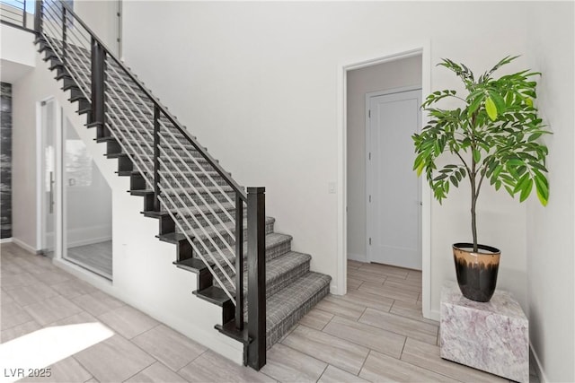 6234 Amber View St, Las Vegas, NV 89135 - stairway featuring wood tiled floors and baseboards