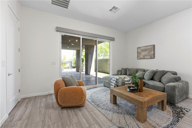6234 Amber View St, Las Vegas, NV 89135 - living room featuring baseboards and light wood-style flooring