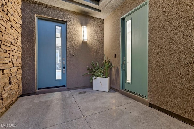 6234 Amber View St, Las Vegas, NV 89135 - doorway to property with stucco siding and a patio