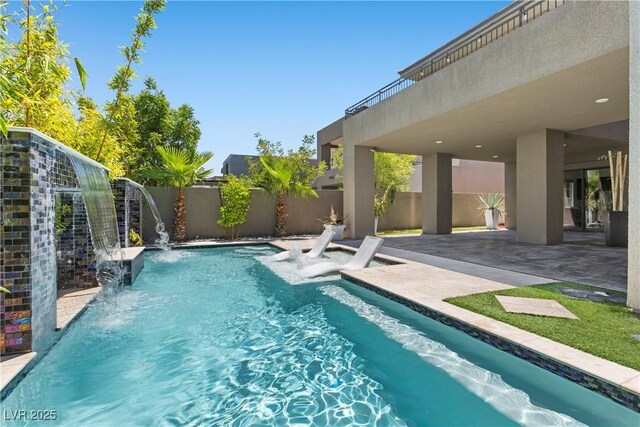 6234 Amber View St, Las Vegas, NV 89135 - view of swimming pool featuring a patio area and a fenced backyard