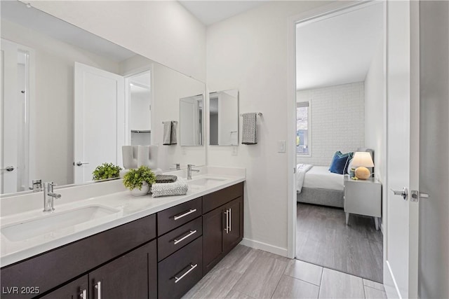 6234 Amber View St, Las Vegas, NV 89135 - ensuite bathroom with double vanity and wood finished floors