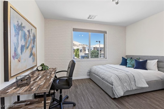 6234 Amber View St, Las Vegas, NV 89135 - bedroom featuring brick wall, wood finished floors, and a desk