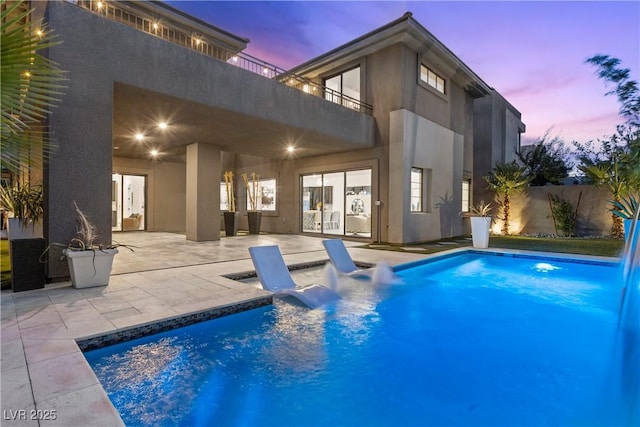 6234 Amber View St, Las Vegas, NV 89135 - pool at dusk featuring a patio