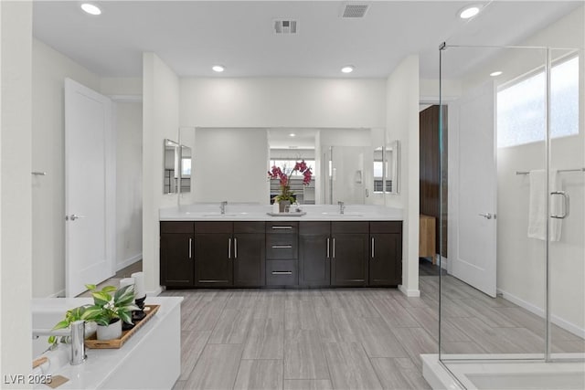 6234 Amber View St, Las Vegas, NV 89135 - full bath featuring double vanity, a shower stall, healthy amount of natural light, recessed lighting, and a closet