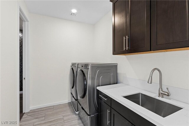 6234 Amber View St, Las Vegas, NV 89135 - laundry room with washer and clothes dryer and cabinet space