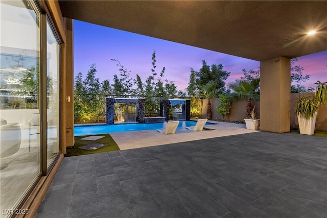 6234 Amber View St, Las Vegas, NV 89135 - patio terrace at dusk featuring a patio and a fenced backyard