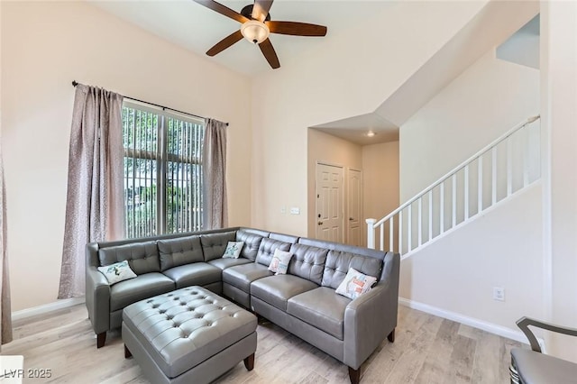 2792 Fountain Ridge Ln, Henderson, NV 89074 - living room featuring a ceiling fan, light wood-type flooring, and stairway