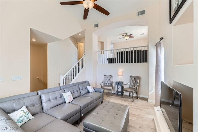 2792 Fountain Ridge Ln, Henderson, NV 89074 - living room with ceiling fan, wood finished floors, a high ceiling, arched walkways, and recessed lighting