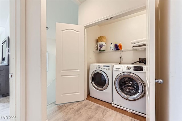 2792 Fountain Ridge Ln, Henderson, NV 89074 - washroom with washing machine and clothes dryer and light wood-style floors