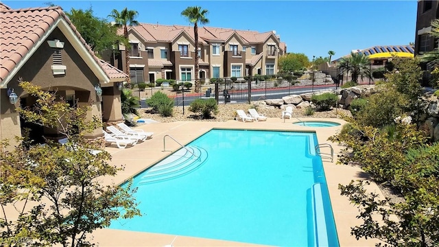 2792 Fountain Ridge Ln, Henderson, NV 89074 - community pool featuring a hot tub, a patio area, and a residential view