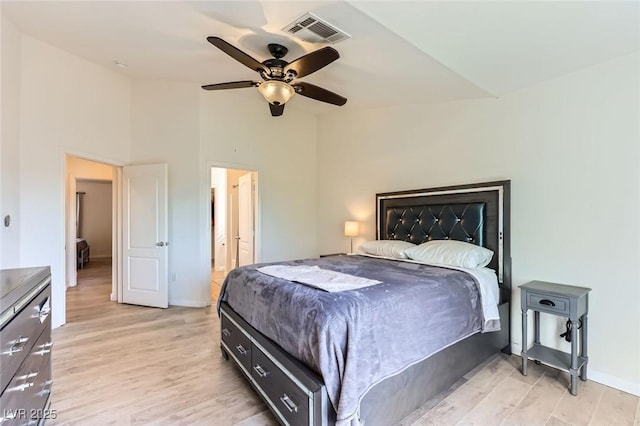 2792 Fountain Ridge Ln, Henderson, NV 89074 - bedroom with light wood finished floors, lofted ceiling, and a ceiling fan