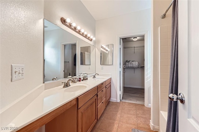 2792 Fountain Ridge Ln, Henderson, NV 89074 - full bathroom with double vanity, tile patterned floors, and a walk in closet