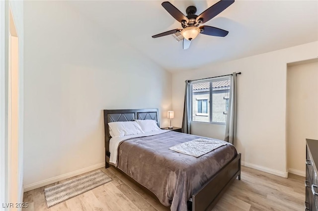 2792 Fountain Ridge Ln, Henderson, NV 89074 - bedroom featuring light wood-type flooring, vaulted ceiling, and a ceiling fan