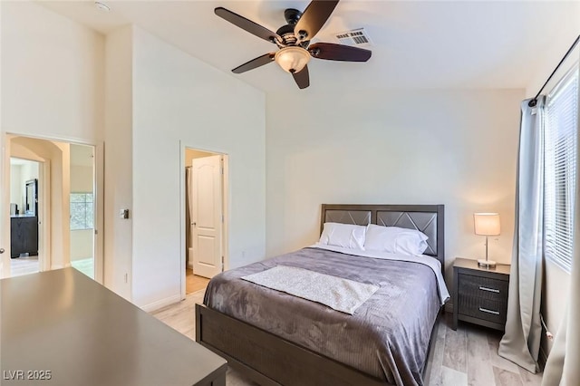 2792 Fountain Ridge Ln, Henderson, NV 89074 - bedroom featuring light wood finished floors, ceiling fan, and high vaulted ceiling