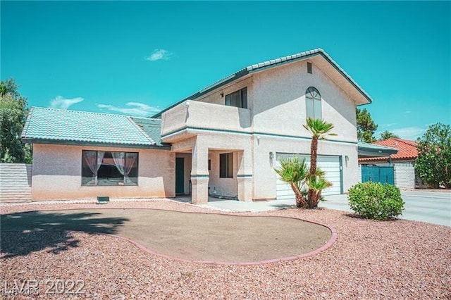 3410 Tanto Cir, Las Vegas, NV 89121 - view of front facade with stucco siding, a tile roof, and a garage